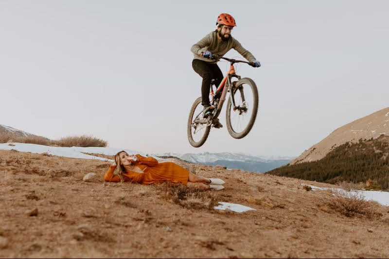 Michael Kussin Jumping Amanda Kussin on a Mountain Bike